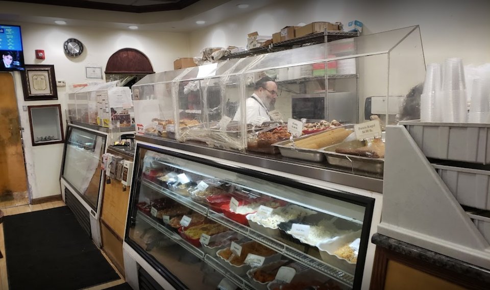 Front view of a kosher takeout restaurant.